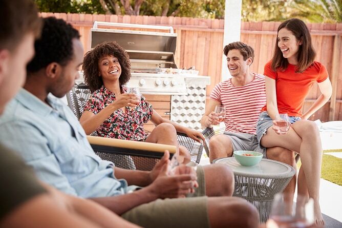 Group of young people sitting on patio
