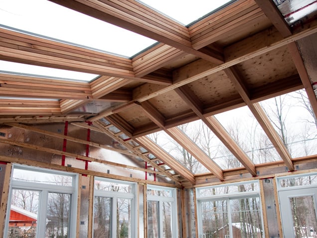 interior photo of framing and windows of a sunroom 