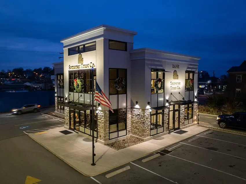 Somerset Trust Uniontown branch viewed from the parking lot at night with the lights on